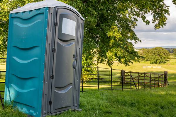 Man accused of pushing over porta-potty with woman, child inside