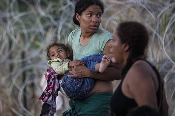 Associated Press images of migrants' struggle are recognized with a Pulitzer Prize