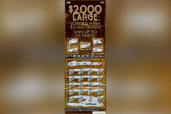 Woman picking up pizza for dinner wins $2M playing lottery
