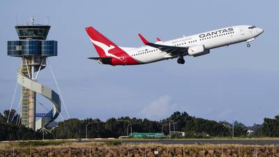 Qantas agrees to pay $79 million in compensation and a fine for selling seats on canceled flights